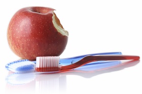 Toothbrushes and apple
